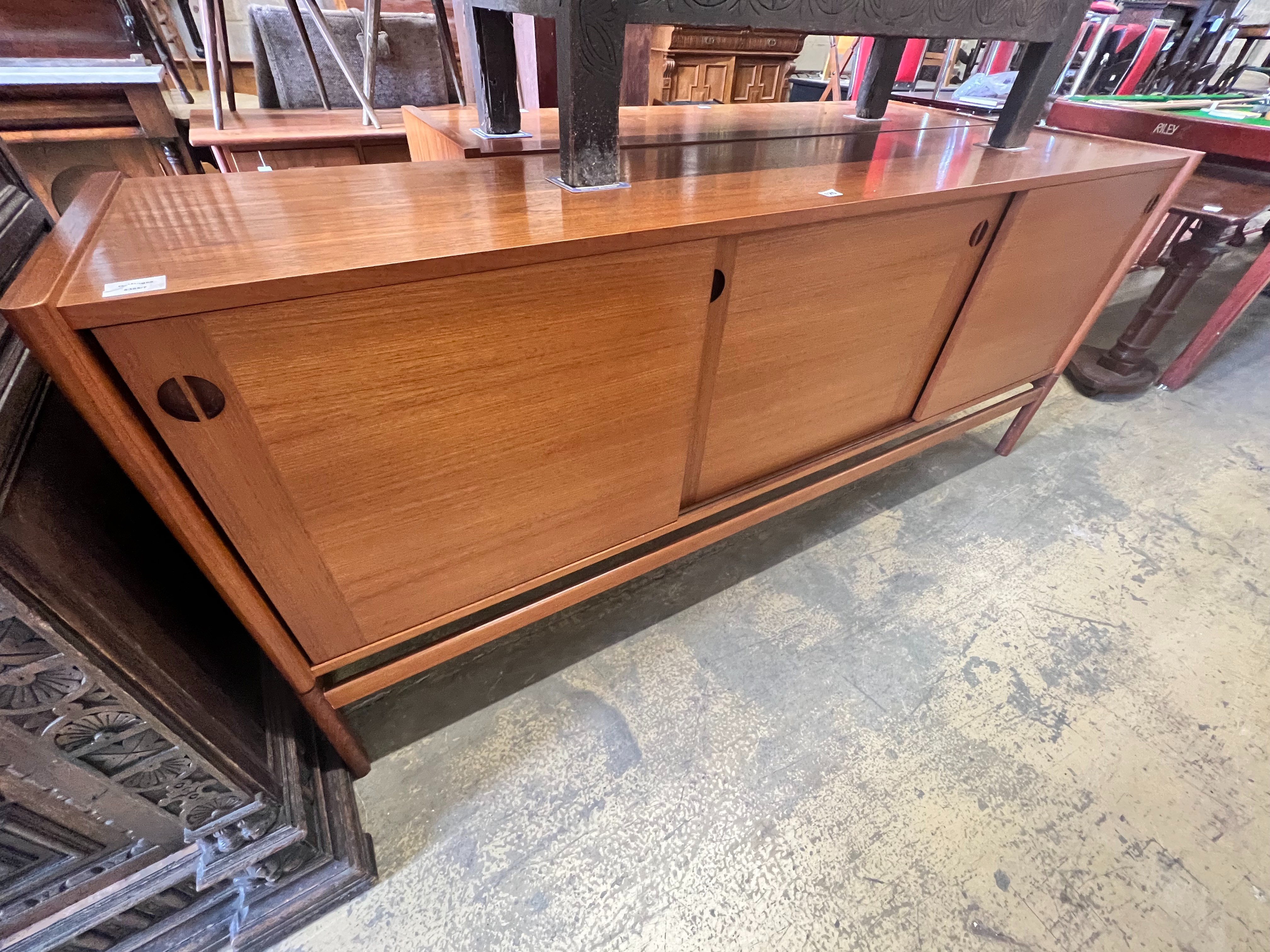 A 1950's Danish teak tambour sideboard, width 200cm depth 46cm height 86cm